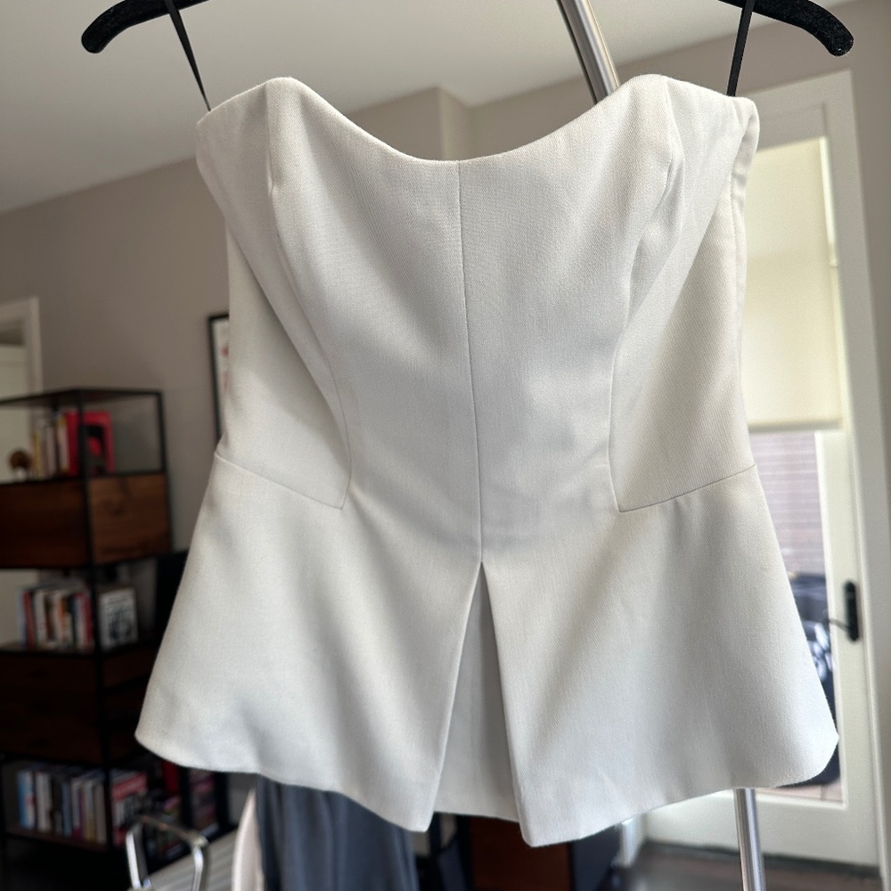 Ivory strapless corset peplum top